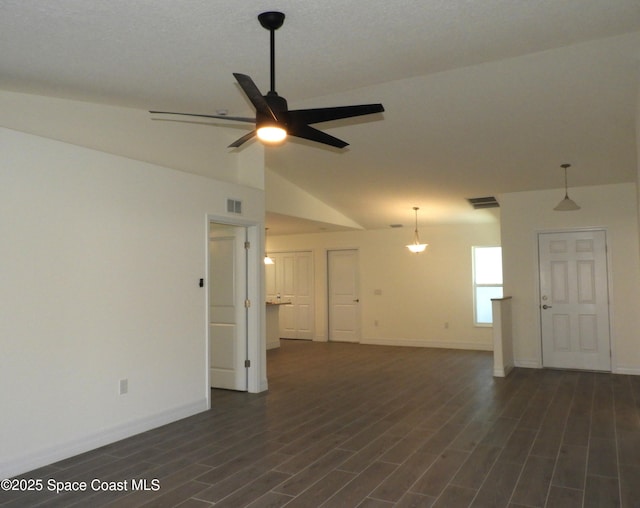 unfurnished room featuring dark wood-style floors, lofted ceiling, visible vents, ceiling fan, and baseboards