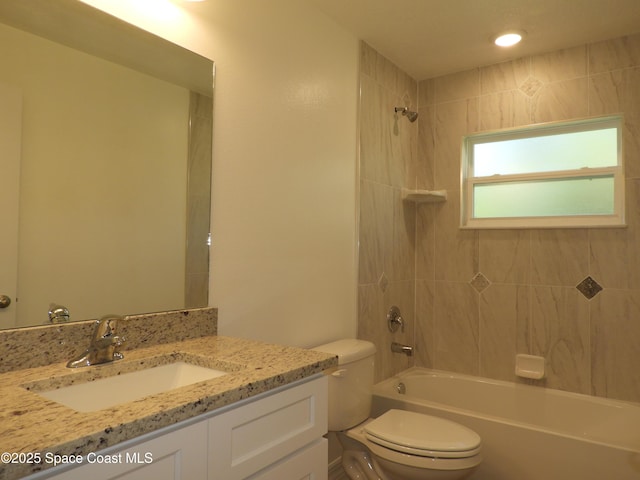 full bath featuring bathing tub / shower combination, vanity, and toilet