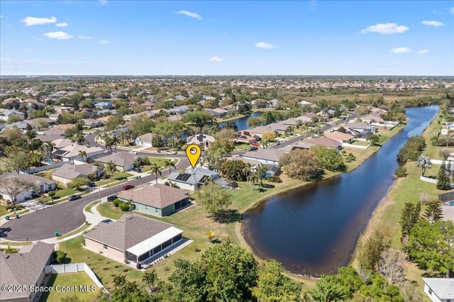 aerial view with a residential view and a water view