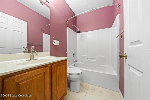 full bath with vanity, tile patterned flooring, a textured ceiling, shower / tub combination, and toilet