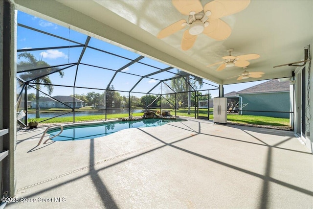 pool featuring glass enclosure, a patio, and ceiling fan