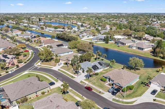 aerial view featuring a residential view and a water view