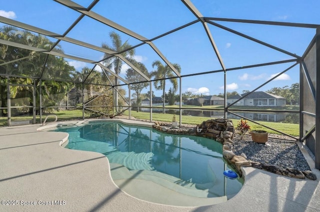 pool with glass enclosure and a patio