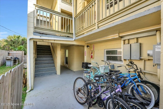 exterior space with a balcony and fence