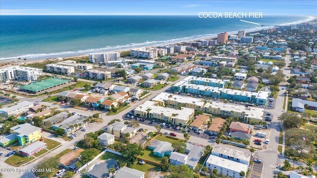 birds eye view of property featuring a city view, a beach view, and a water view