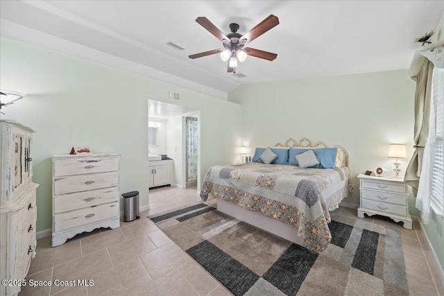 bedroom with lofted ceiling, ceiling fan, light tile patterned flooring, and visible vents