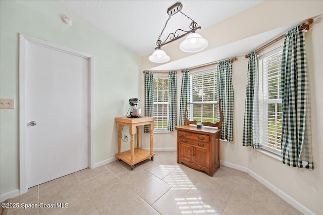 interior space featuring light tile patterned floors and a wealth of natural light