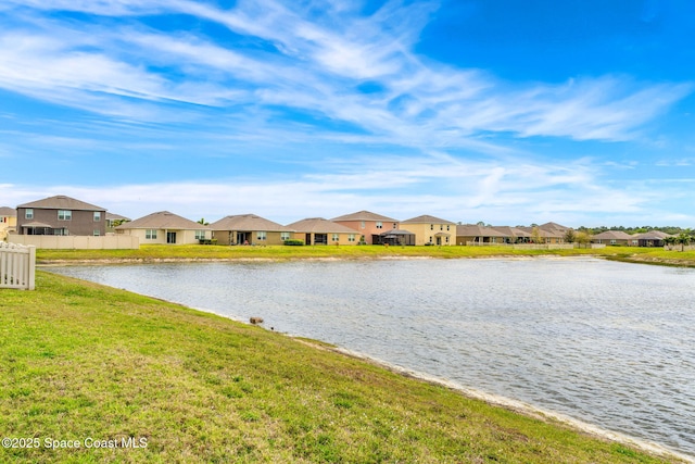 water view featuring a residential view and fence