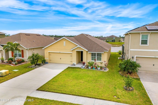 view of front of property featuring driveway, a shingled roof, a front yard, and stucco siding