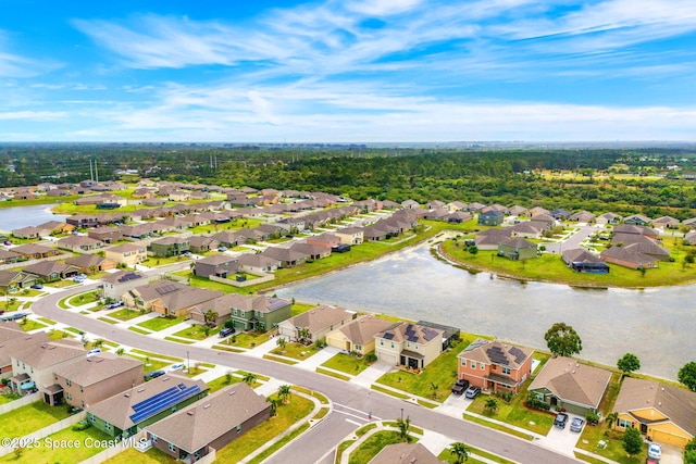 bird's eye view with a water view and a residential view