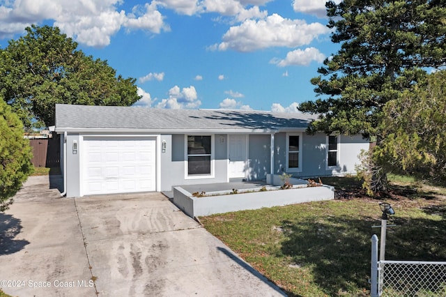 ranch-style home featuring a garage, driveway, fence, and stucco siding