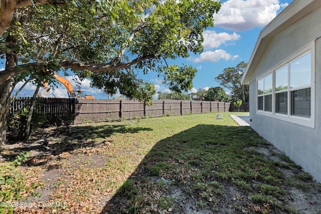 view of yard with a fenced backyard