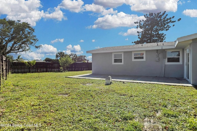 view of yard with a patio area and a fenced backyard