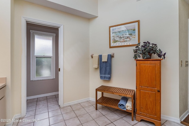 bathroom featuring tile patterned floors, vanity, and baseboards