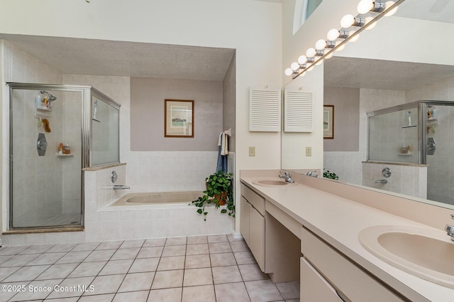 bathroom with a garden tub, a sink, and a shower stall