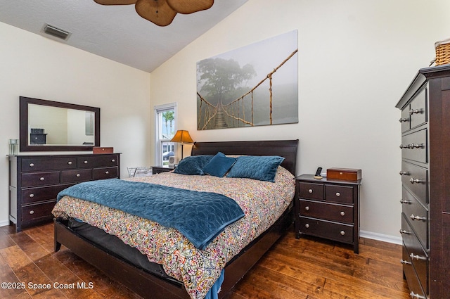 bedroom featuring lofted ceiling, hardwood / wood-style flooring, baseboards, and visible vents