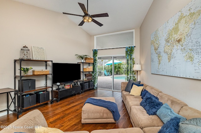 living room with ceiling fan, vaulted ceiling, and wood finished floors