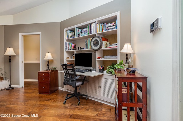 office featuring baseboards and wood finished floors