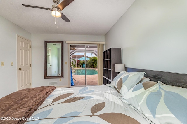 bedroom with visible vents, a ceiling fan, a sunroom, and access to exterior