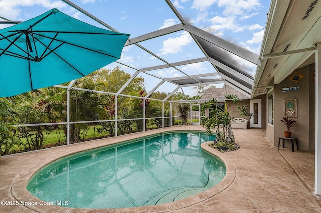 outdoor pool featuring a lanai and a patio