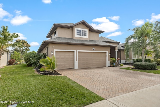 view of front of home featuring a garage, a shingled roof, decorative driveway, a front lawn, and stucco siding