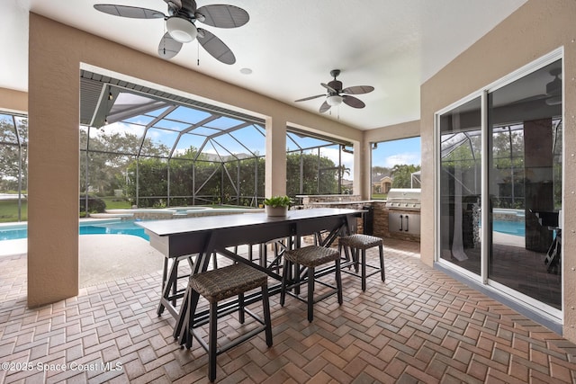 sunroom with ceiling fan and a swimming pool