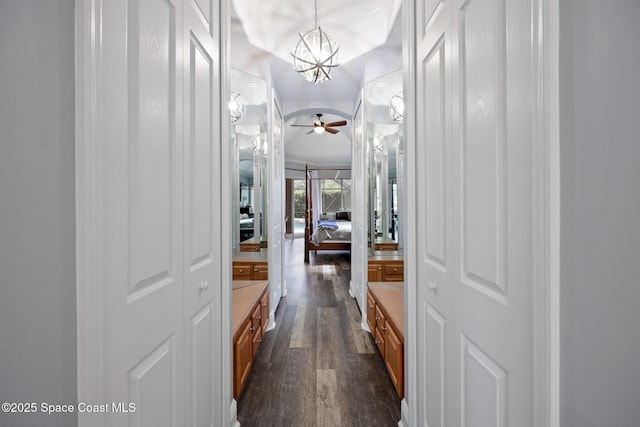 bathroom featuring vanity, wood finished floors, and ceiling fan with notable chandelier