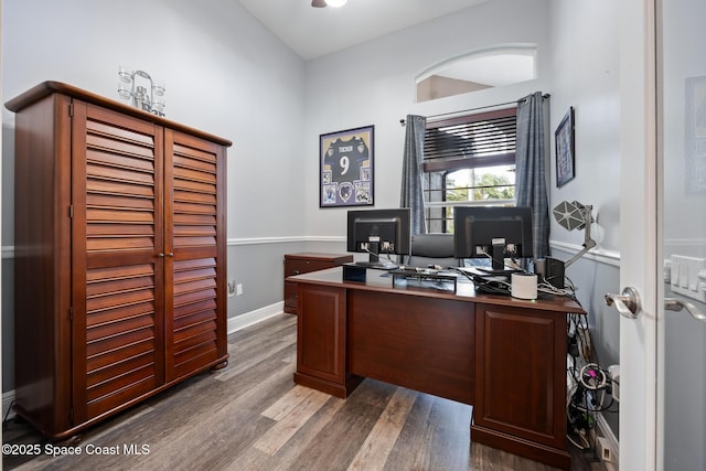 office area featuring baseboards and wood finished floors