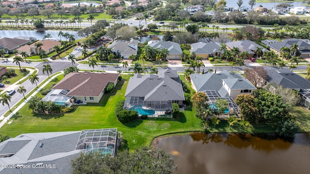 bird's eye view featuring a water view and a residential view