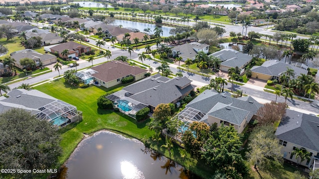 aerial view featuring a residential view and a water view