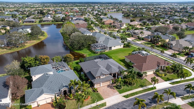 bird's eye view featuring a residential view and a water view