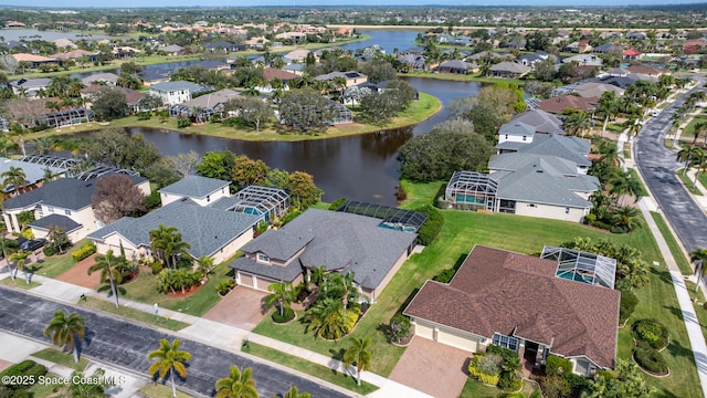 bird's eye view with a water view and a residential view