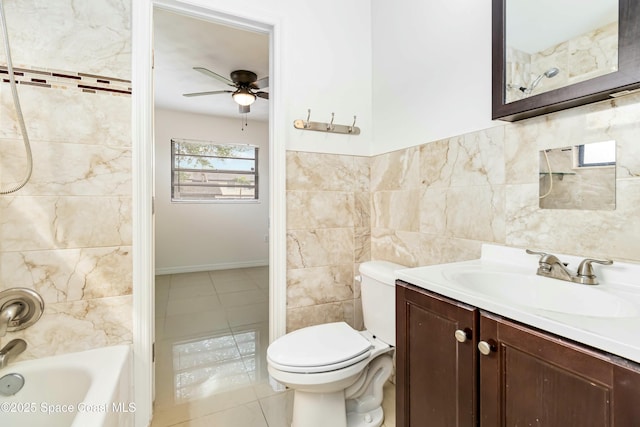 full bathroom with toilet, ceiling fan, tile patterned flooring, vanity, and tile walls