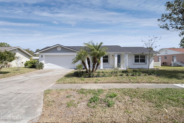 ranch-style house with driveway, a front yard, an attached garage, and stucco siding