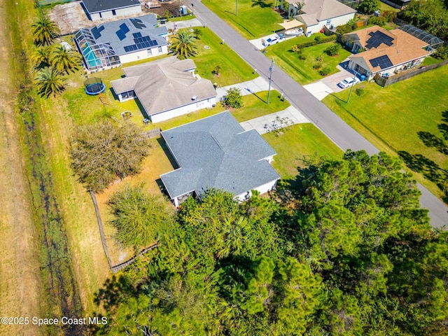 birds eye view of property with a residential view