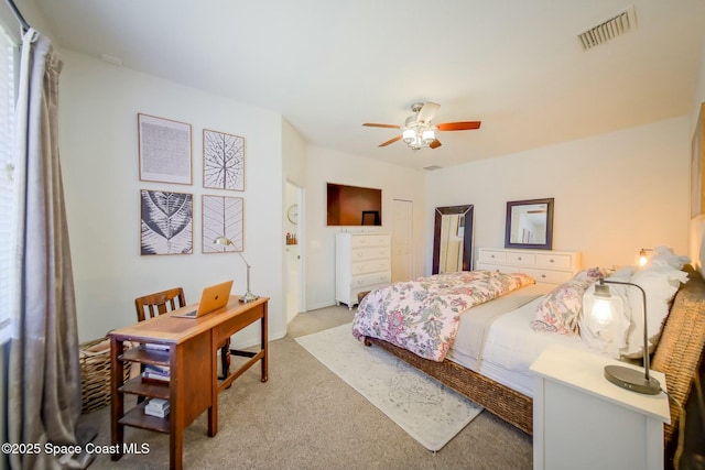 bedroom with a ceiling fan, carpet, and visible vents