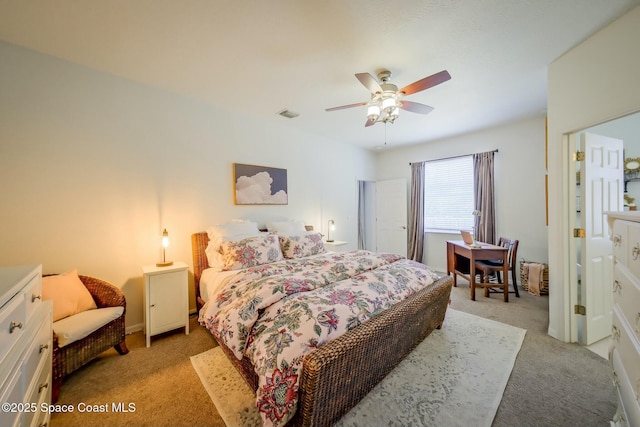 bedroom featuring light carpet, ceiling fan, and visible vents