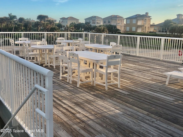 wooden terrace with outdoor dining area