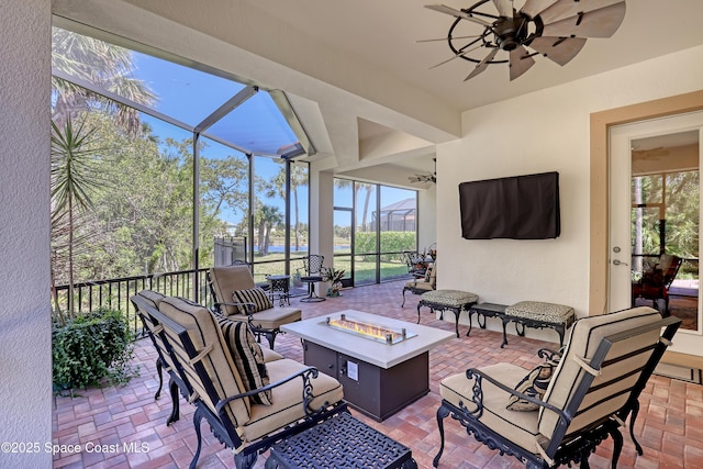 sunroom / solarium with a ceiling fan