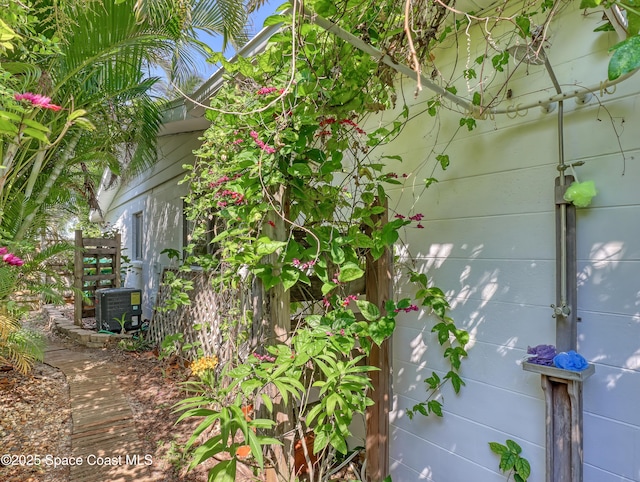 view of side of property featuring central AC unit