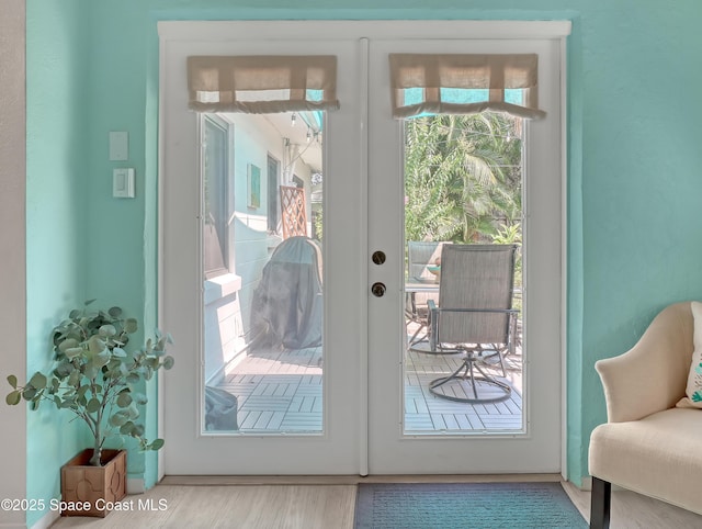 entryway with french doors and wood finished floors