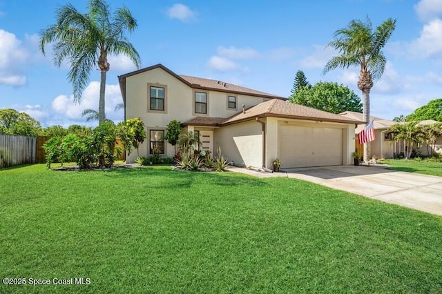 view of front facade with concrete driveway, a front yard, fence, and stucco siding