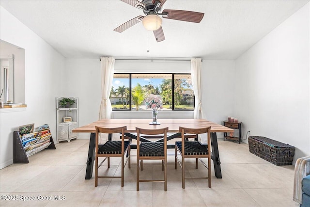 dining room featuring ceiling fan and light tile patterned flooring