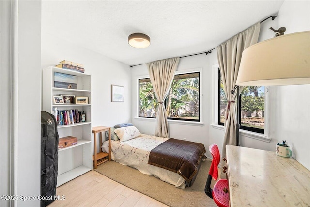 bedroom featuring wood finished floors