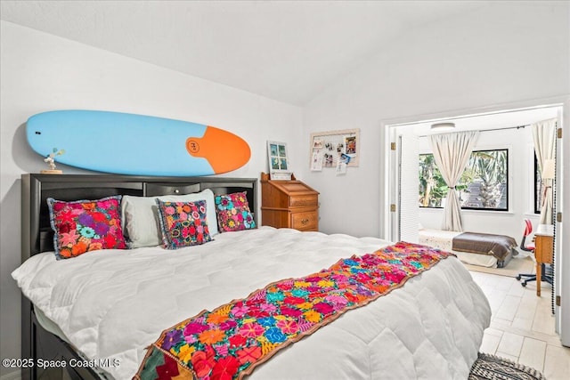 bedroom with lofted ceiling