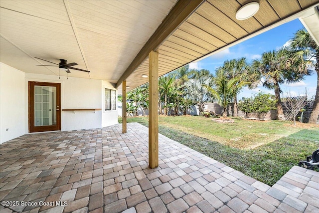 view of patio / terrace with a fenced backyard and a ceiling fan