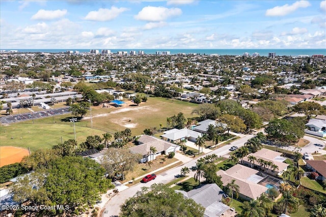 birds eye view of property featuring a water view and a residential view