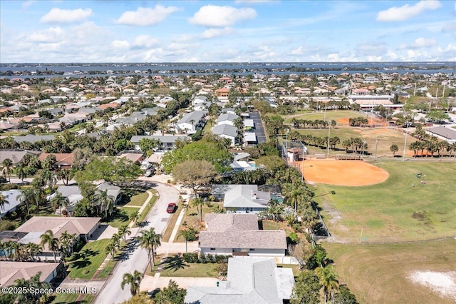 drone / aerial view with a residential view and golf course view