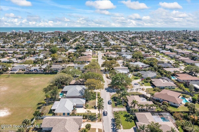 aerial view featuring a water view and a residential view