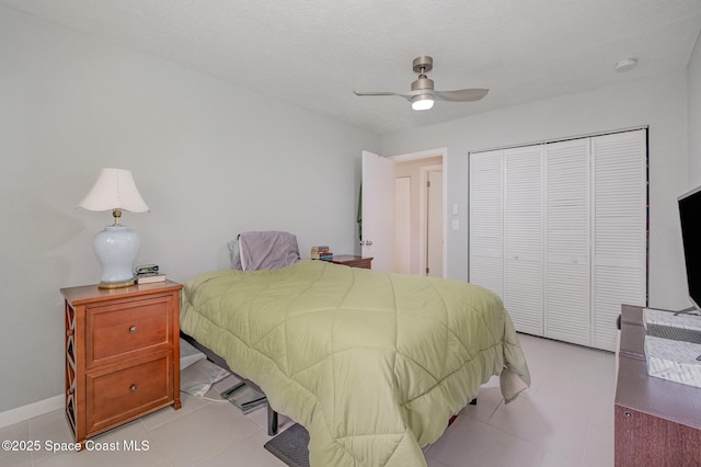 bedroom featuring a ceiling fan and a closet